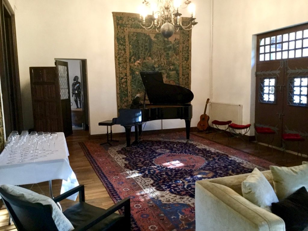 baby grand piano in chateau