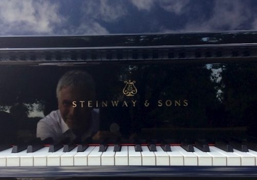 reflected in a steinway